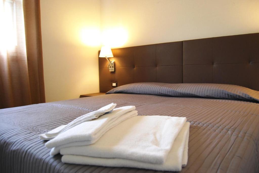 Residenze Al Colle Dei Pini Aparthotel Ριτσόνε Δωμάτιο φωτογραφία