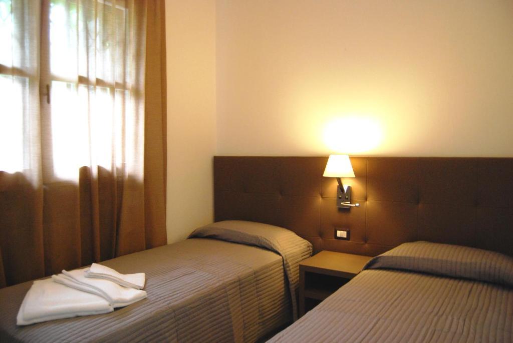 Residenze Al Colle Dei Pini Aparthotel Ριτσόνε Δωμάτιο φωτογραφία